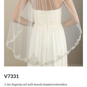 V7331 1-tier fingertip veil with heavily beaded embroidery Enhance your wedding day look with a gorgeously beaded and embroidered veil