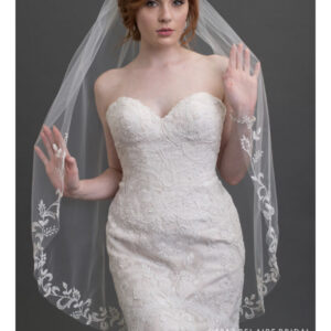 V7426 1-tier fingertip veil with cut edge at sides and embroidered leaf design Add nature-inspired elegance to your ensemble