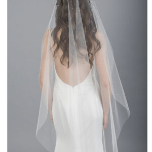 V7682 1-tier cut edge cascade knee length veil with pearls and crystals across comb and scattered throughout veil