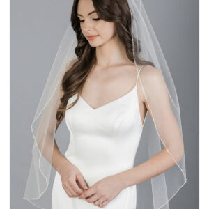 V7684 1-tier fingertip veil with delicate edge of pearls, crystals, and beads